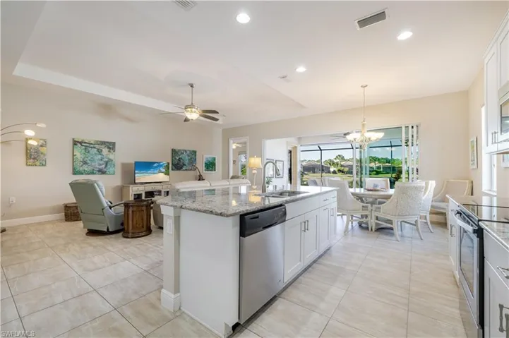 Granite Countertops and Stainless Steel appliances.  Low bar island - Builder Upgrade