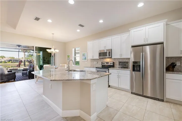 Granite Countertops and Stainless Steel appliances.  Low bar island - Builder Upgrade