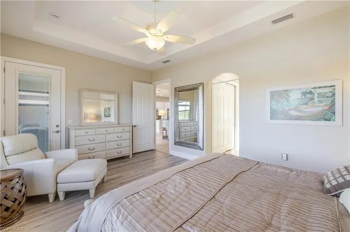 Large Primary Bedroom with private door to lanai pool area. (Builder Upgrade)