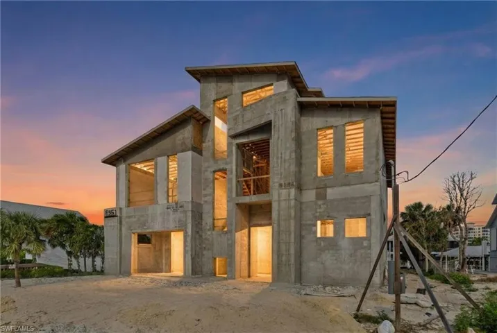 View of back of house at dusk