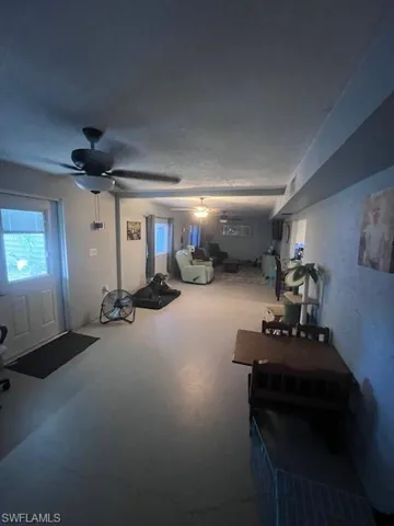 Basement with ceiling fan