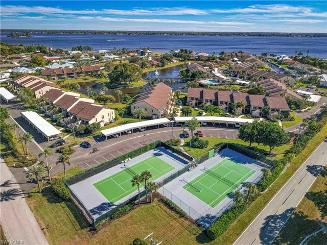 Aerial perspective of suburban area with a nearby body of water