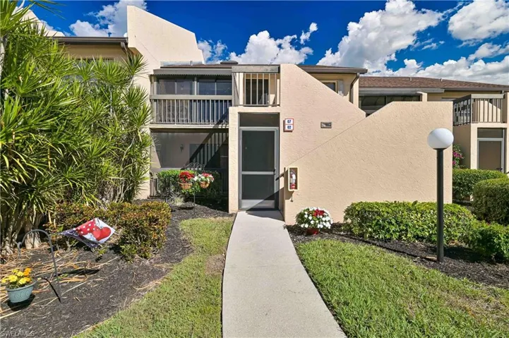 Property entrance featuring stucco siding