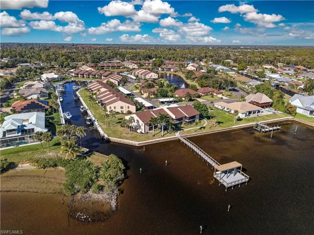 Aerial perspective of suburban area with a large body of water