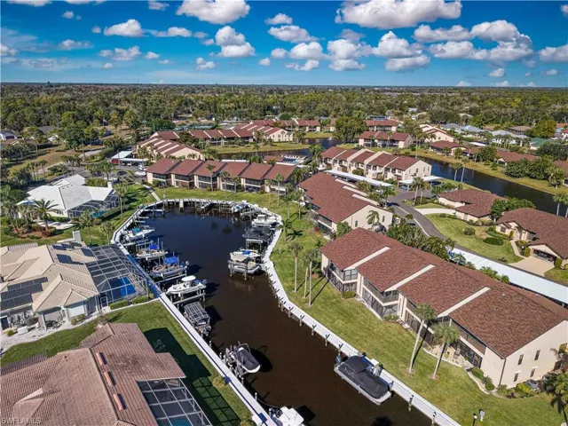 Aerial view of residential area featuring a large body of water