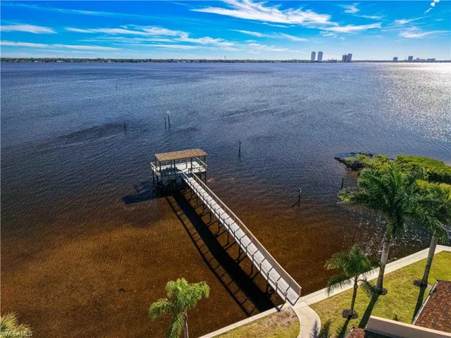 Dock area featuring a water view