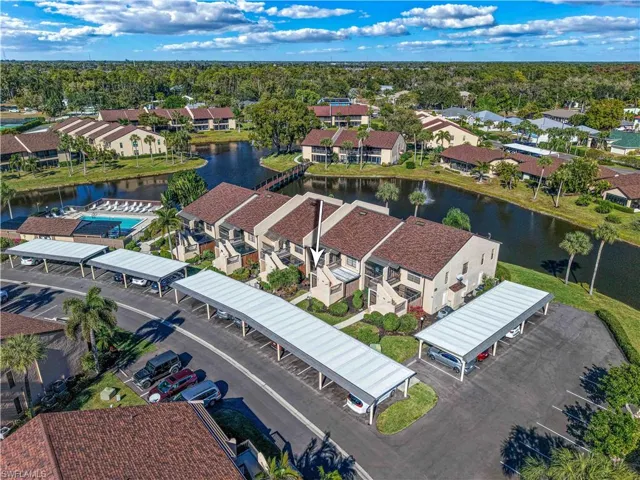 Aerial perspective of suburban area with a nearby body of water