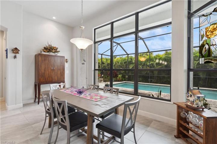 Family dining overlooking lanai & pool