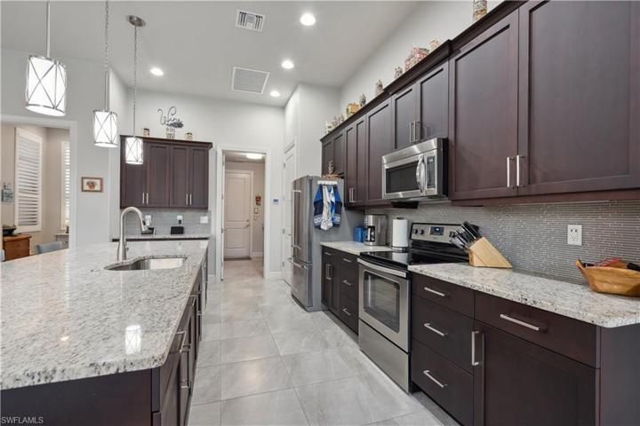 Doorway leads to laundry room & garage with workshop.