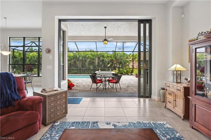 View through 10' pocket sliding doors to wide span view of lanai with no posts
