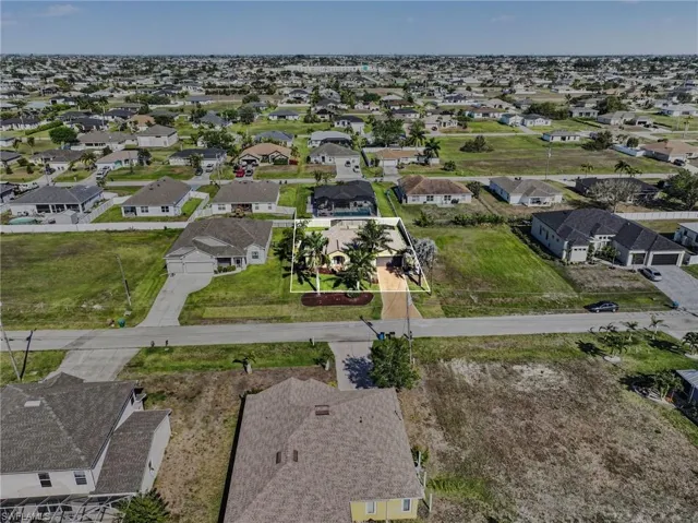 View of property location with nearby suburban area