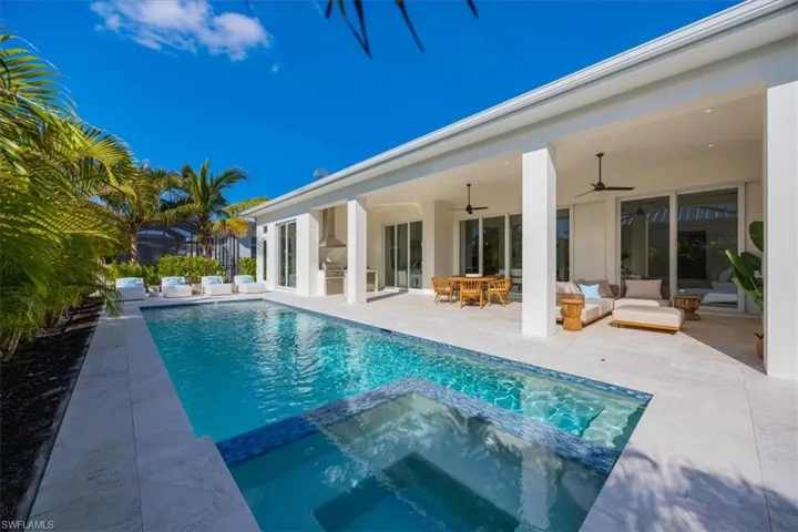 4554 Seagrove Landing Way is a pre-construction customized Dune plan purchase agreement. The photos in this listing are of a recently constructed and staged Dune plan with similar materials and features in the same community. This plan may be built as shown or customized.