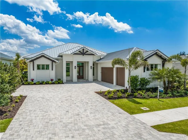 4554 Seagrove Landing Way is a pre-construction customized Dune plan purchase agreement. The photos in this listing are of a recently constructed and staged Dune plan with similar materials and features in the same community. This plan may be built as shown or customized.