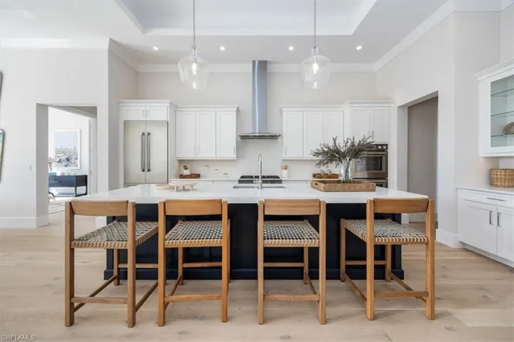 4554 Seagrove Landing Way is a pre-construction customized Dune plan purchase agreement. The photos in this listing are of a recently constructed and staged Dune plan with similar materials and features in the same community. This plan may be built as shown or customized.