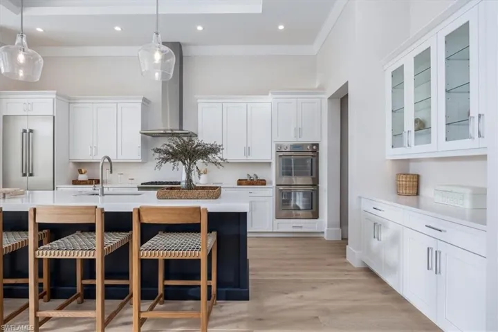 4554 Seagrove Landing Way is a pre-construction customized Dune plan purchase agreement. The photos in this listing are of a recently constructed and staged Dune plan with similar materials and features in the same community. This plan may be built as shown or customized.