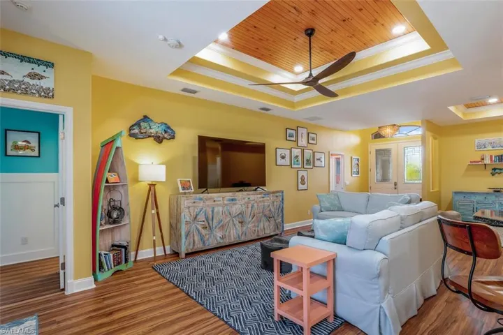 Living room with entry to Master & hallway to split bedrooms