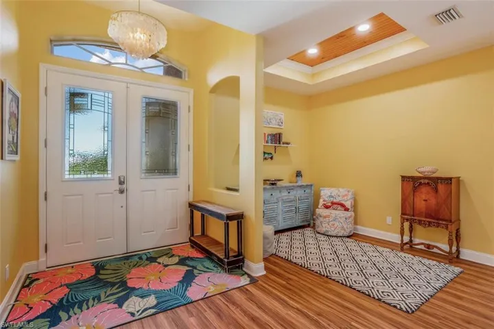 Foyer front doors & flex space (dining, office, seating area)