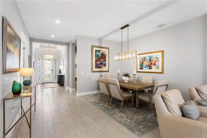 Dining space featuring hanging lights and light wood-style flooring