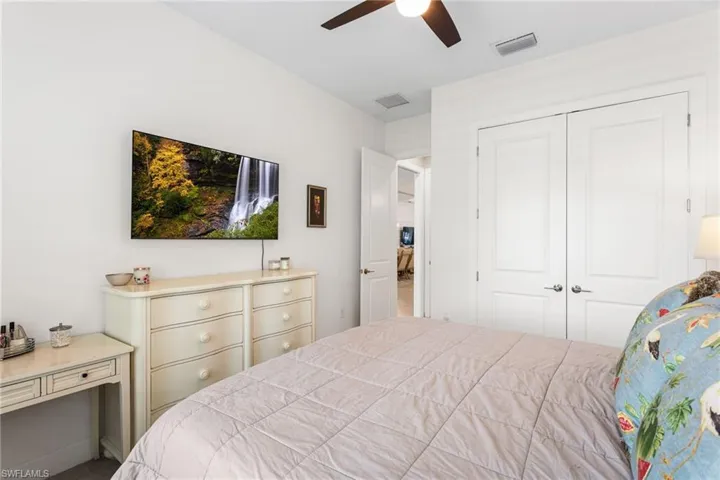 Bedroom featuring a closet and ceiling fan