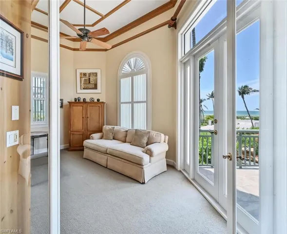 Sunroom featuring french doors and ceiling fan