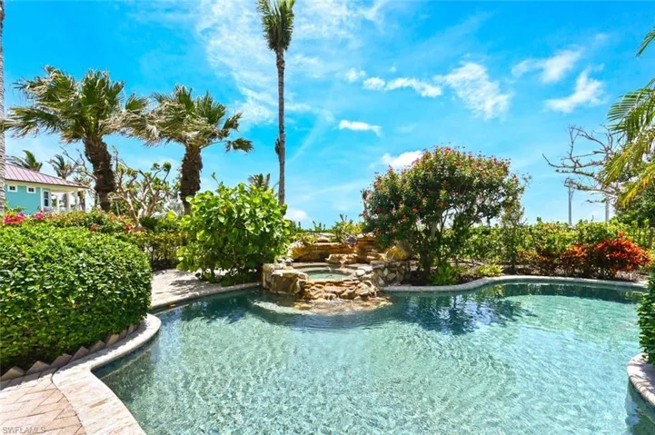 View of pool featuring an in ground hot tub