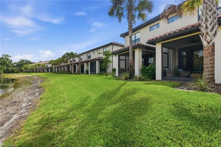 Terrace homes featuring stucco exteriors, terracotta-style roof tiles, and screened-in patios