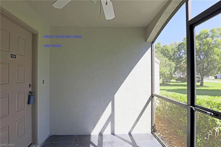 SCREENED FRONT LANAI --- FRONT ENTRY DOOR --1ST FLOOR/NO STAIRS --- CEILING FAN