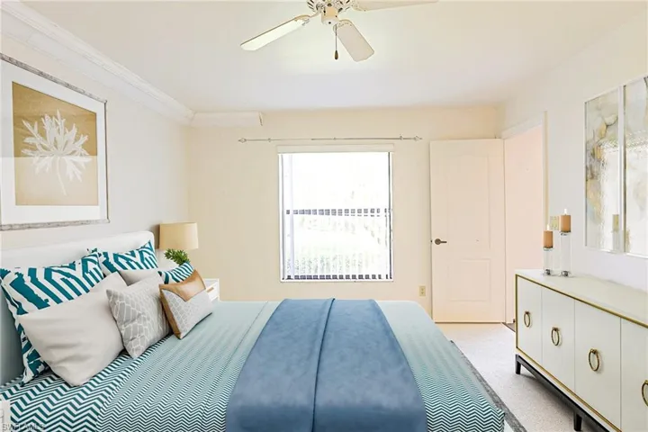 Main Bedroom. Door off Dining Room. Staged Photo.