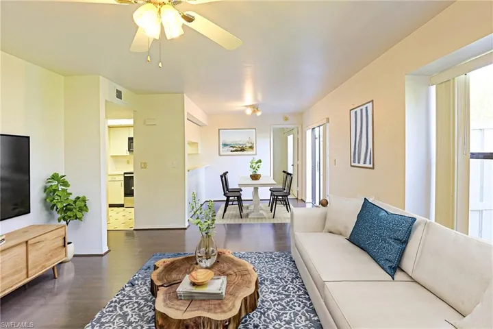 Living Room to Dining Room and Kitchen. Staged Photo
