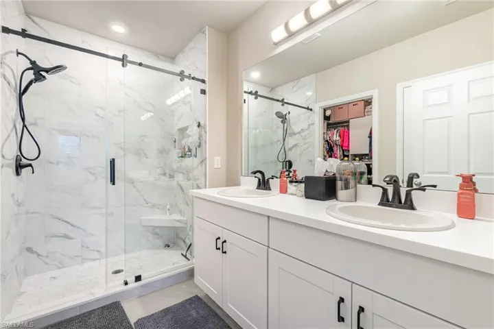 Upgraded ensuite with double bowl vanity, upgraded shower and customized Closets by Design walk-in closet.