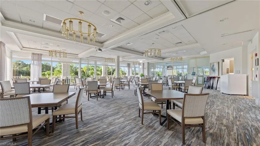Dining space with plenty of natural light, coffered ceiling, a chandelier, and beamed ceiling