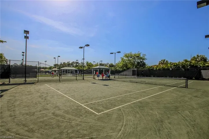 View of tennis court with community basketball court