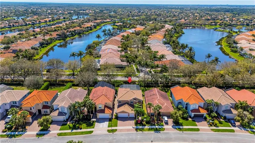 Drone / aerial view featuring a residential view and a water view