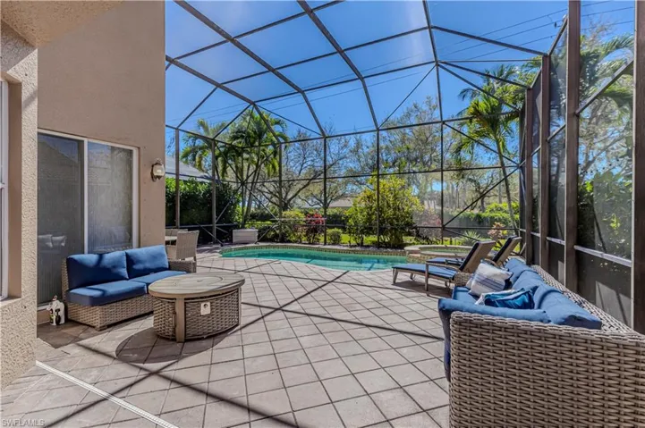 View of patio / terrace with glass enclosure and an outdoor pool