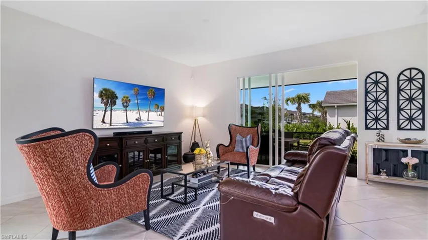 Living room with light tile patterned floors