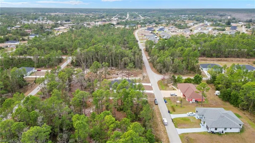 View of property location with nearby suburban area