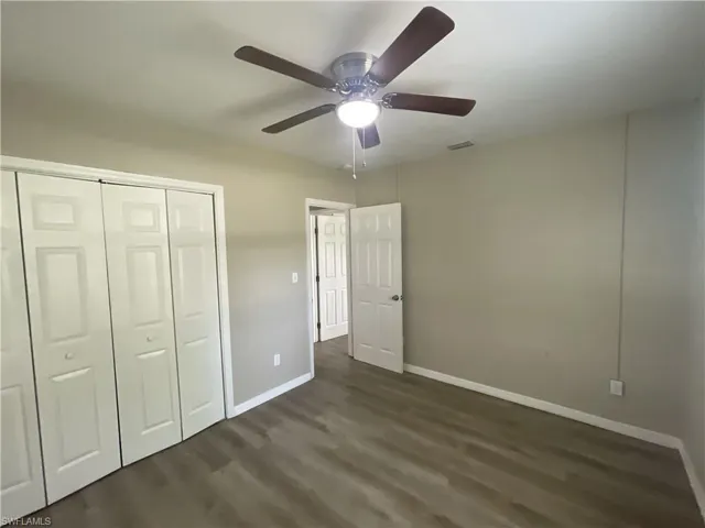 Unfurnished bedroom featuring  a closet, and a ceiling fan