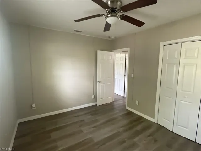 Unfurnished bedroom with a closet, and a ceiling fan