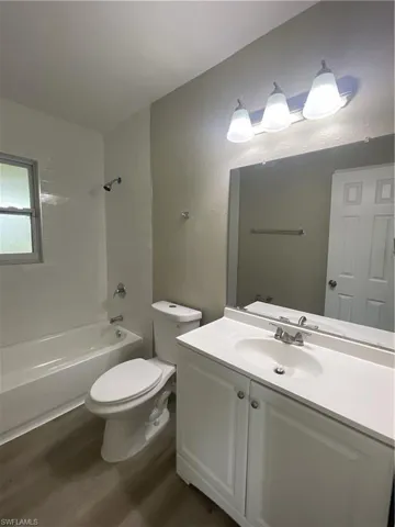 Full bath featuring vanity, bathing tub / shower combination