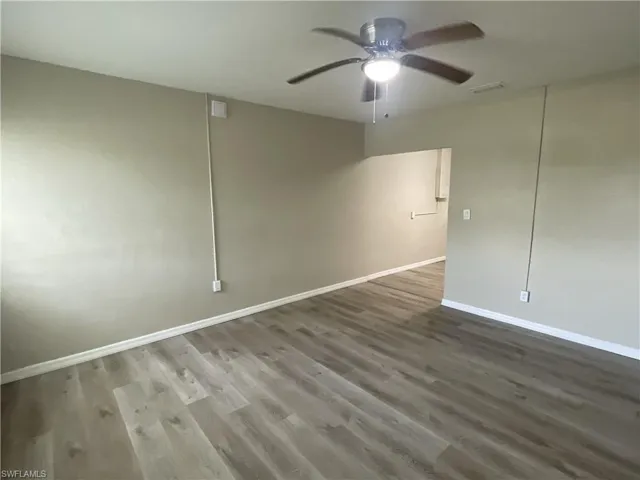 Living room featuring a ceiling fan