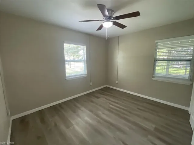 Bedroom featuring wood finished a ceiling fan