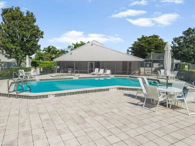 Community pool featuring a patio area and a community hot tub