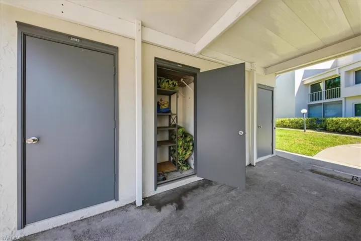 Property entrance featuring stucco siding