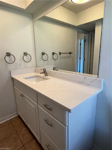 Bathroom featuring vanity and tile patterned flooring