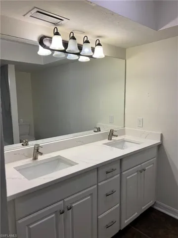 Master Full bath with double vanity and toilet