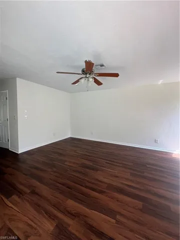 Master bedroom featuring LVP finished floors and a ceiling fan