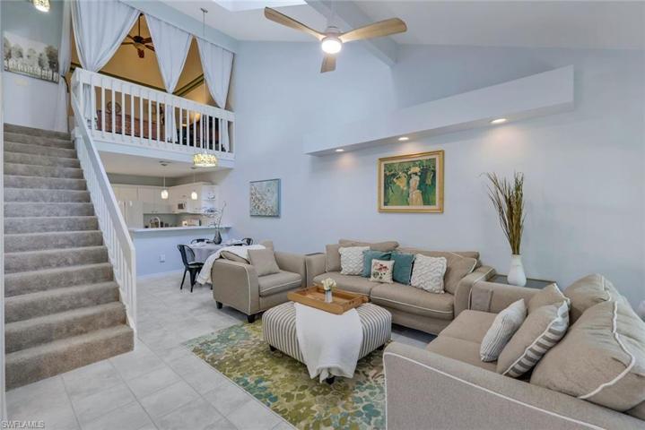 Looking towards the kitchen, loft and stairway to the 2nd living space