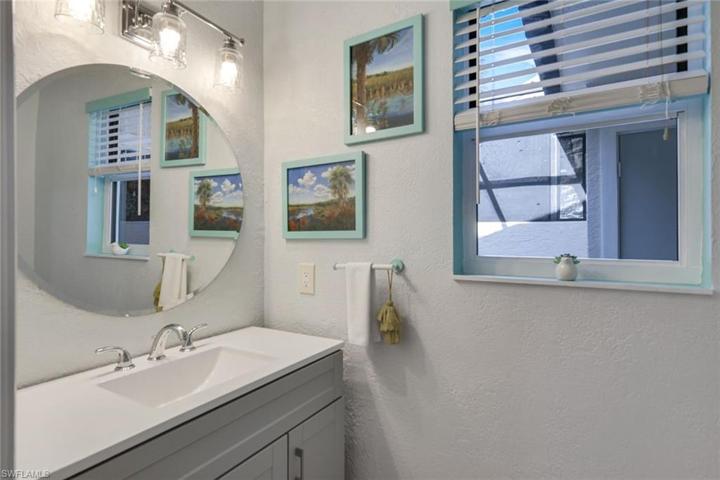 1st floor 1/2 bath off living & screened lanai