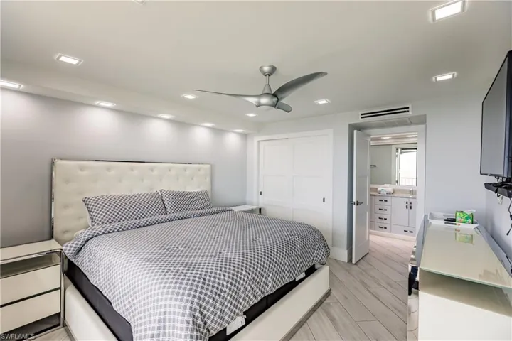 Bedroom with ceiling fan, wood finish floors, a closet, and recessed lighting