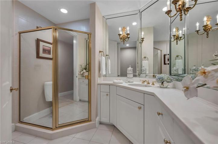 The third guest suite bathroom is very spacious with a walk-in shower and elegant touches.
